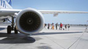 Aircraft engine in soft blurred foreground with defocused boarding area outdoor; background backdrop backplate template. - Powered by Shutterstock - Get 15% off with code: PIKWIZARD15