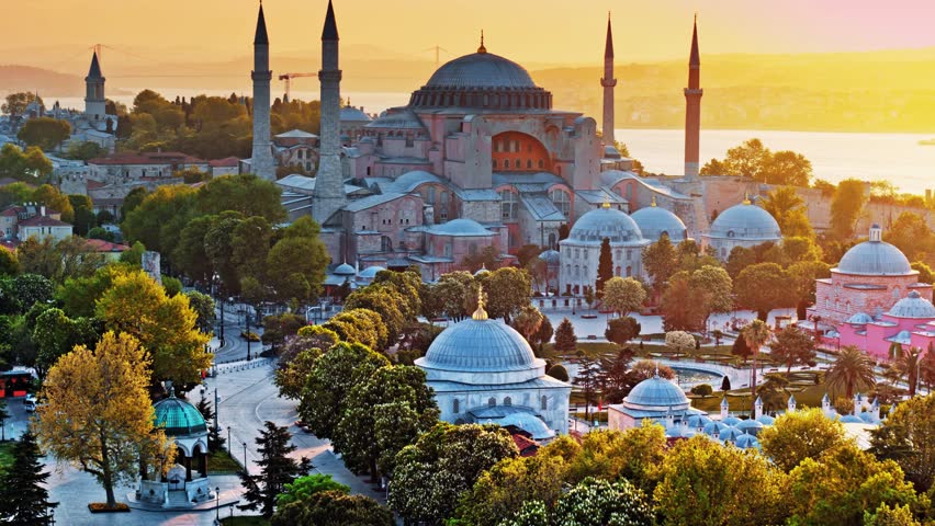 Stunning 4K aerial view of Hagia Sophia, Istanbul, showcasing its majestic dome, historic architecture, surrounding cityscape, and Bosporus backdrop—perfect for travel, drone, and cultural heritage 