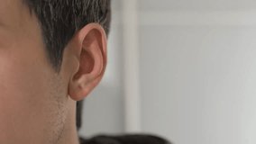 Man cupping his hand to his ear to hear better, illustrating listening, attention, communication, and curiosity in a personal or professional context. - Powered by Shutterstock - Get 15% off with code: PIKWIZARD15