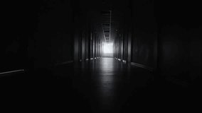 Wide pan of a dark, empty hospital hallway, creating a moody, eerie, and suspenseful atmosphere suitable for medical, thriller, or cinematic use. - Powered by Shutterstock - Get 15% off with code: PIKWIZARD15