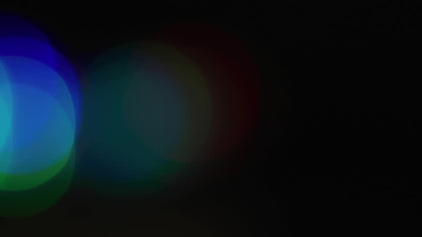 On play cursive holidays sliding across bokeh shifting and blending behind glossy text for greeting. Typography, font, metallic, beveled, glow, festive, celebration