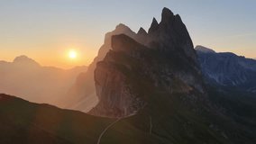 drone shot of sunrise on Seceda in the Dolomites, an iconic mountain in Dolomites, Italy, the Italian picturesque Pues Odle nature park in the Dolomite mountains.  - Powered by Shutterstock - Get 15% off with code: PIKWIZARD15