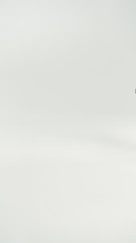 Woman adjusting and walking in black low heel shoes with tights