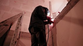 A welder welds a steel beam - Powered by Shutterstock - Get 15% off with code: PIKWIZARD15