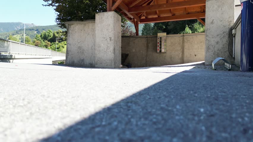 aerial rising footage of road in the alps (austria brenner pass) drone view from above river train track scenic mountain landscape europe