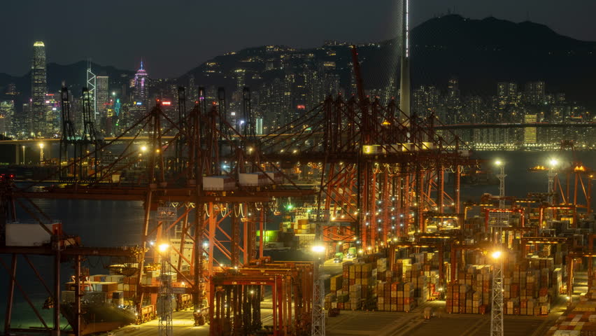 Large buzy container cargo freight ship terminal at night in Hong kong, China, time lapse, 4k