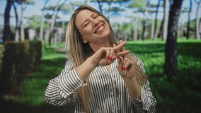 Woman makes hashtag sign with fingers among trees in sunlit green park; joy social media communication. - Powered by Shutterstock - Get 15% off with code: PIKWIZARD15