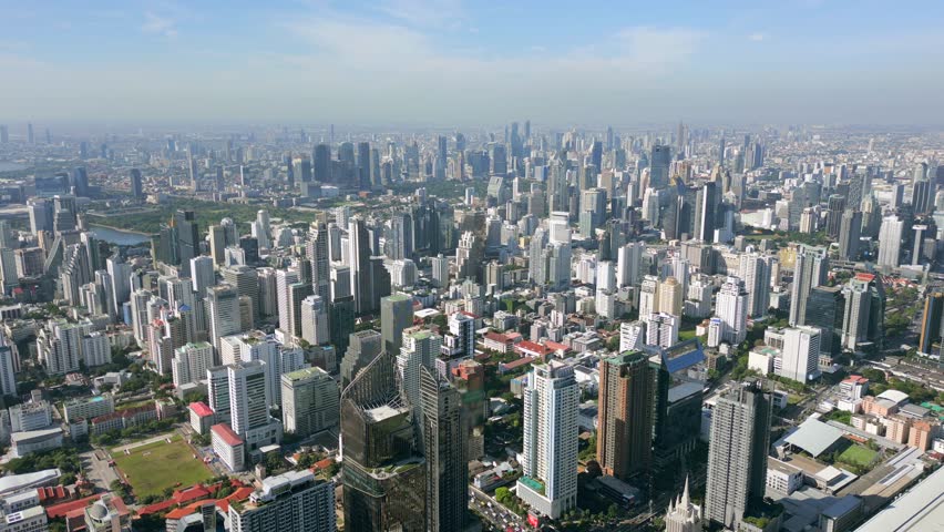 Aerial view of Bangkok, Thailand with modern skyscrapers, urban skyline, and dense cityscape. Southeast Asia