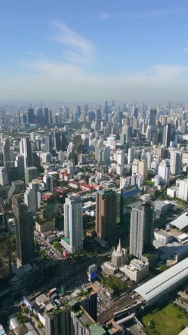 Aerial view of Bangkok, Thailand with modern skyscrapers, urban skyline, and dense cityscape. Southeast Asia