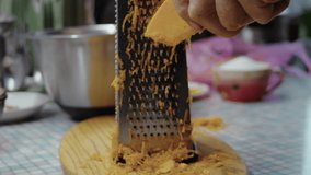 Close-up, elderly woman's hand grating pumpkin on pie grater - Powered by Shutterstock - Get 15% off with code: PIKWIZARD15