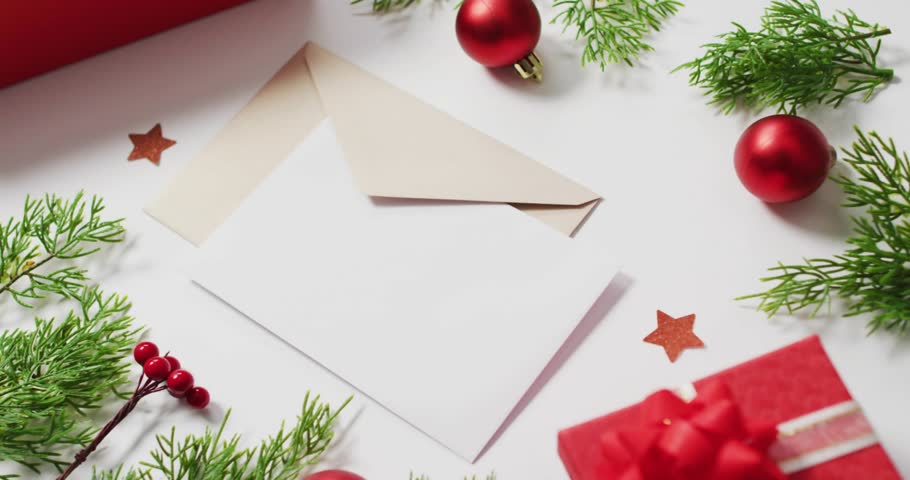 Hand-drawn strokes sliding from top-left building MERRY CHRISTMAS over flat-lay for holiday card. Typography, animated, greeting, festive, lettering, ornament, evergreen