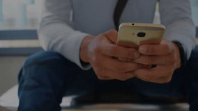 Businessman tapping and swiping phone by window, reviewing animated market charts with percentages. Device, hands, daylight, office, analytics, dashboard, data - Powered by Shutterstock - Get 15% off with code: PIKWIZARD15