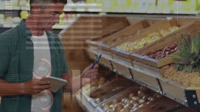 Mature man reading notes and checking produce, selecting pineapple while charts overlaying subject. Market, fruit, retail, inventory, notebook, weight, focused - Powered by Shutterstock - Get 15% off with code: PIKWIZARD15