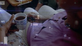 HUD fading in starting hand holding teacup, purple sitter shifting arm, charts visualizing data. Porcelain, tea, floral, lavender, sofa, livingroom, lifestyle - Powered by Shutterstock - Get 15% off with code: PIKWIZARD15