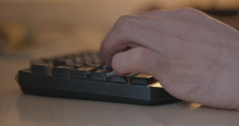 Man is Playing Games on Computer. 4K 10-bit