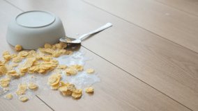 Spilled Cereal on Wooden Floor 4k - Powered by Shutterstock - Get 15% off with code: PIKWIZARD15