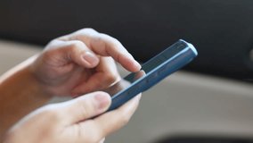 hand holding and using smartphone inside car for navigation gps, showing technology and communication while traveling, close-up - Powered by Shutterstock - Get 15% off with code: PIKWIZARD15