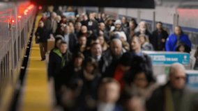 Extreme slow-motion shot of commuters exiting a train inside Grand Central Station. Busy New York transit scene capturing movement, daily travel, urban life, and crowd activity. - Powered by Shutterstock - Get 15% off with code: PIKWIZARD15