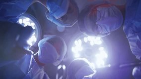 Surgeons wearing face masks holding surgical instruments in an operating theatre, illustrating medical procedures, teamwork, and healthcare professionalism. - Powered by Shutterstock - Get 15% off with code: PIKWIZARD15