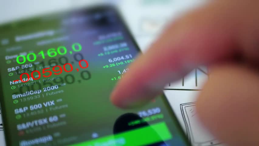 Businessman checking stock market data on a smartphone, illustrating financial monitoring, investment tracking, and modern business technology. - Powered by Shutterstock - Get 15% off with code: PIKWIZARD15