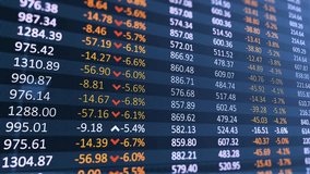Digital table of stock market values showing company indices rising and falling, illustrating financial trends, business growth, and market analysis. - Powered by Shutterstock - Get 15% off with code: PIKWIZARD15