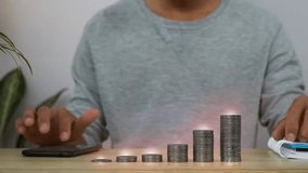 Businessman analyzing data with a holographic display of charts and coin stacks, illustrating business growth, finance, and financial strategy. - Powered by Shutterstock - Get 15% off with code: PIKWIZARD15