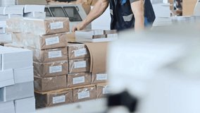 Factory worker packing boxes in a warehouse for delivery, showcasing logistics, industrial workflow, and organized shipping operations. - Powered by Shutterstock - Get 15% off with code: PIKWIZARD15