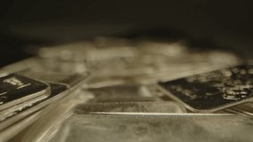 Macro focus rack of detailed shiny silver plates on a velvet surface in a well lit studio - Powered by Shutterstock - Get 15% off with code: PIKWIZARD15