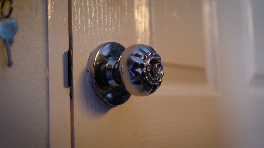 Close up of a hand of the woman is opening and closing a door