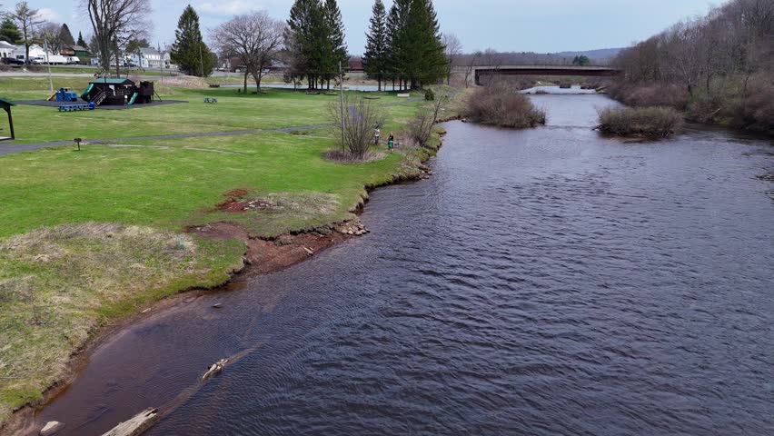 Riverside park with playground and trees along Blackwater River in Davis, WV, USA
