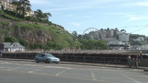 DEVON, UK - AUGUST 2012: Traffic passing the seafront and promenade at Torquay in Devon.