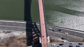 Drone aerial, wide 24mm, hovering orbit over New York City, USA--Manhattan skyline in clean daylight. Smooth ascend and descend showcase glass skyscrapers, iconic bridges, the Hudson and East River... - Powered by Shutterstock - Get 15% off with code: PIKWIZARD15