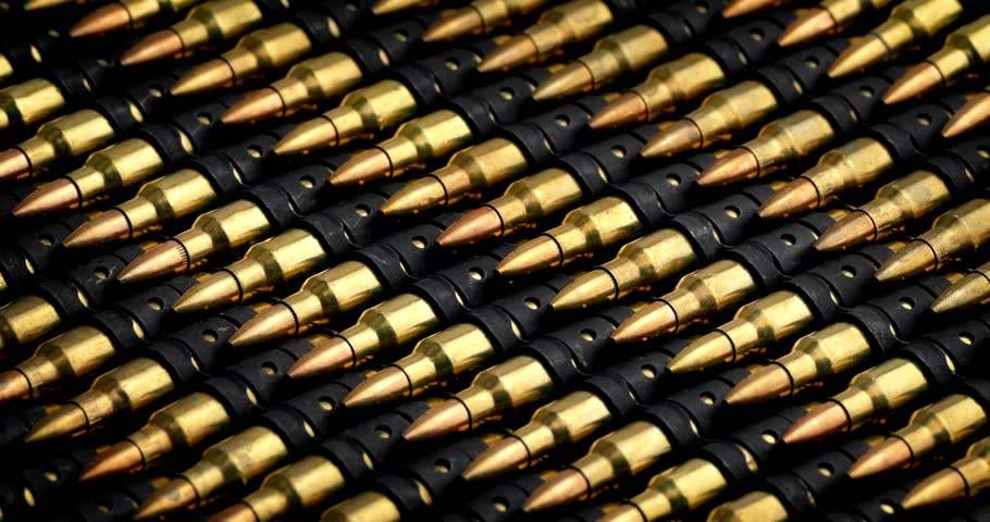 Closeup Bullets Mass Production Concept Bullet in a row. Group of ammo gun riffle glock machine guns cinematic