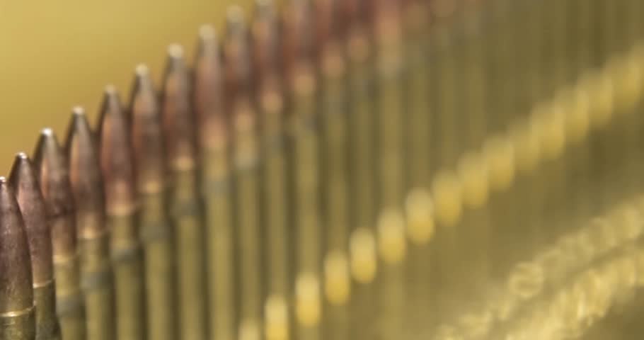 Closeup Bullets Mass Production Concept Bullet in a row. Group of ammo gun riffle glock machine guns cinematic