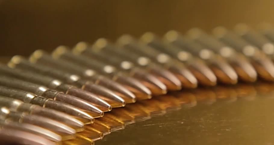 Closeup Bullets Mass Production Concept Bullet in a row. Group of ammo gun riffle glock machine guns cinematic
