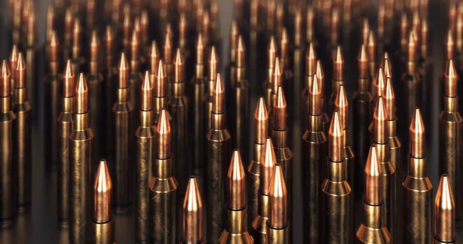 bullets lined isolated. 4k rifle ammo on dark background seamless loopable black gun crime military target war