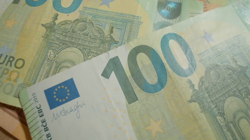 Explore the detailed features of a 100 euro banknote, highlighting its unique designs, colors, and security elements. Learn about its significance in Europe.