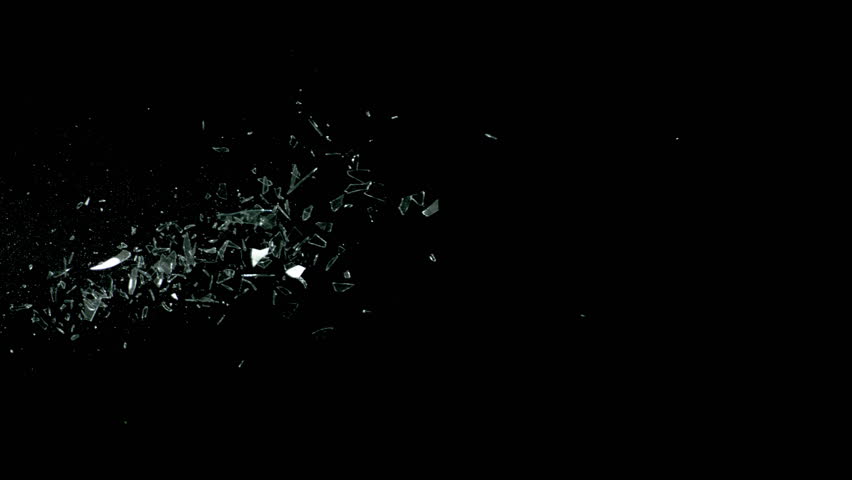 Super Slow Motion Shot of Real Side-Flying Glass Shards Isolated on Black at 1000 fps.