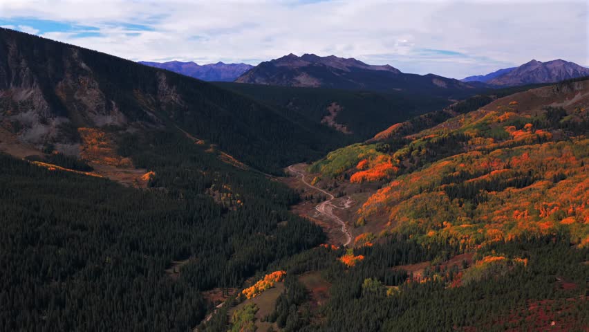 Crested Butte ski town Colorado fall autumn season Ohio Swampy Kebler Pass Lake Irwin aerial drone Rocky Mountains Elk Range Gunnison national forest colorful Aspen Trees windy dirt road cars forward