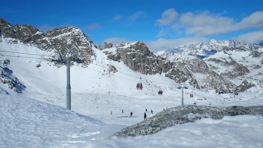 A beautiful view of people skiing on the Presena Glacier in Italy