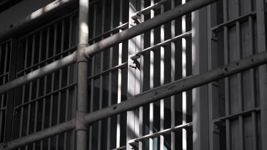 Interior of a Prison Cell with Iron Bars, Penitentiary and Correctional Facility Footage, Security and Confinement Concept