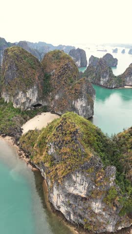 Peaceful Drone footage of Ha Long Bay, with limestone karsts and islets, Vietnam