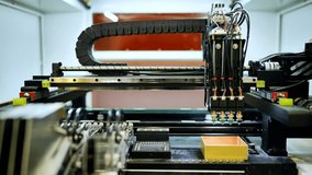 Industrial robotic arm installing components for electronics manufacturing and automation - Powered by Shutterstock - Get 15% off with code: PIKWIZARD15