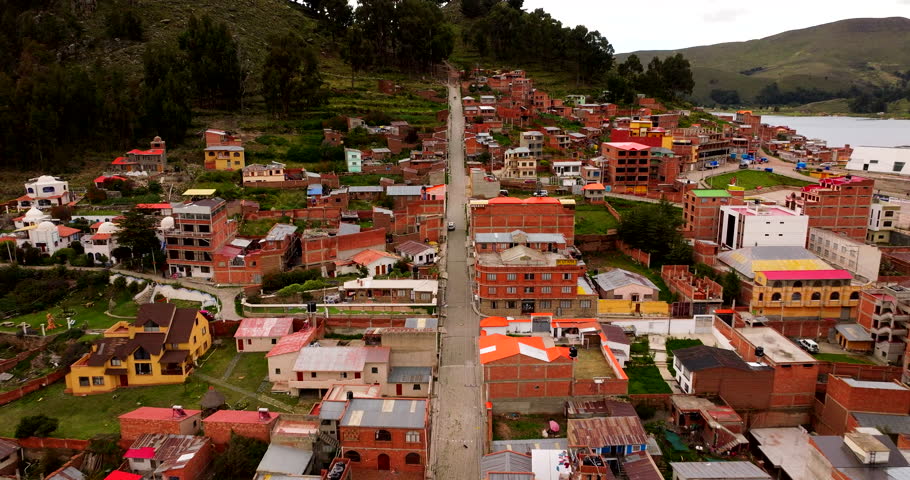 Copacabana town on shores of Lake Titicaca, Bolivia. Aerial forward