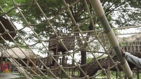 Child climbing rope net at outdoor playground adventure activity - Powered by Shutterstock - Get 15% off with code: PIKWIZARD15