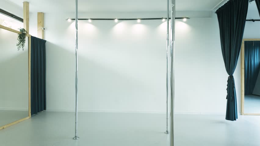 Elastic girl with long ponytail practicing Acro dance with pole dance bar - Powered by Shutterstock - Get 15% off with code: PIKWIZARD15