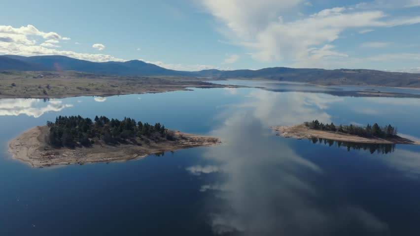 Aerial: Drone shot over two islands on Lake Jindabyne, NSW, Australia
