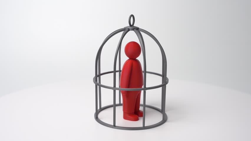 A red person in a cage. Restrictions and self-isolation from opportunities for growth and development. Limited freedom, and workplace pressure. Employment law. Contractual obligations.