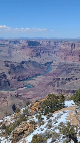Grand Canyon landscape with Colorado River and snow in Arizona, USA