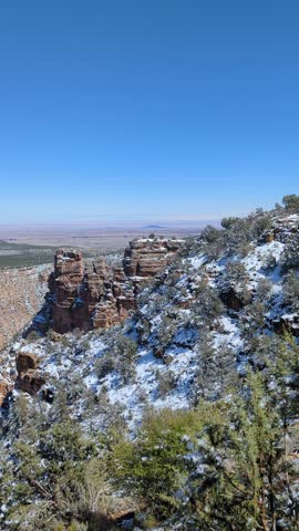 Panning view of the snowy Grand Canyon East Rim in Arizona, USA